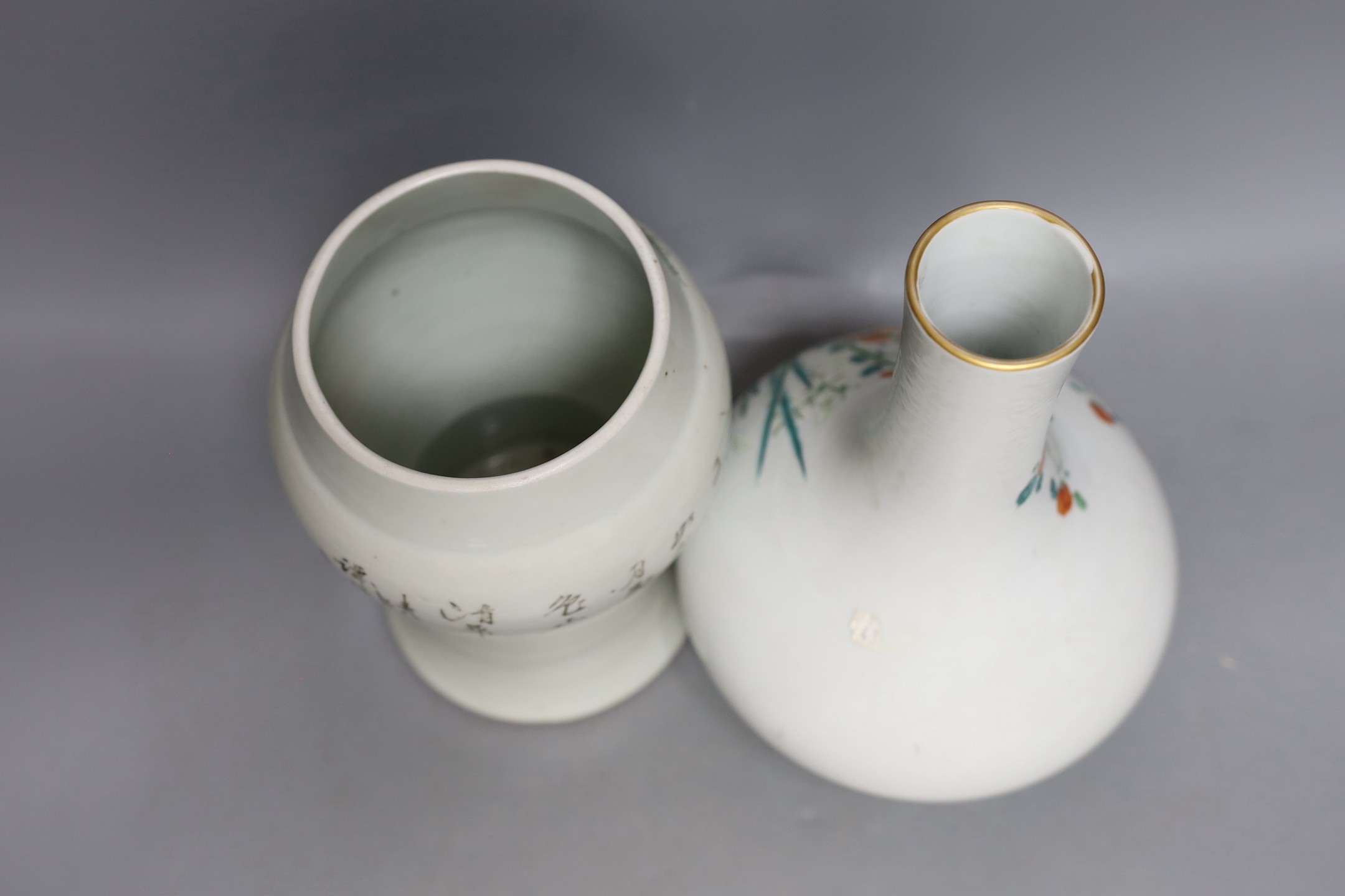 A Chinese enamelled porcelain bottle vase, 25cm high, together with a Chinese porcelain baluster jar, early 20th century, painted with figures and script